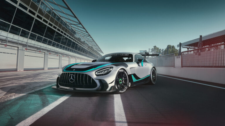 Promo pic of the Mercedes-AMG GT2 Edition W16 on a race track with a grandstand on the left-hand side